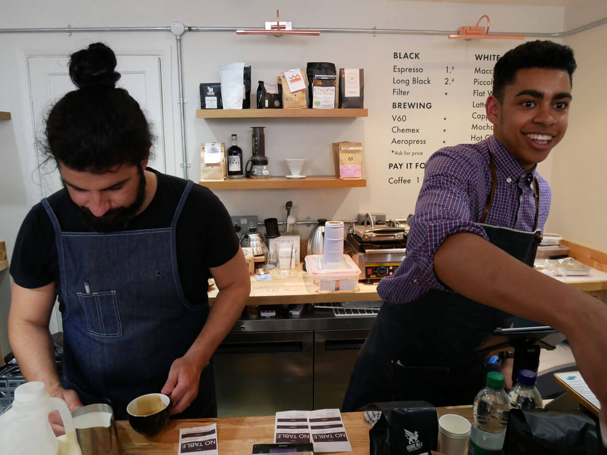 Barista making coffee in Second Shot